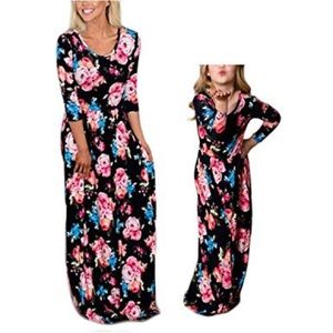 Mom and me matching black floral maxi dresses.